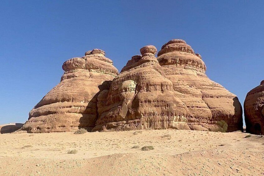 A desert landscape with prominent rock formations. 5