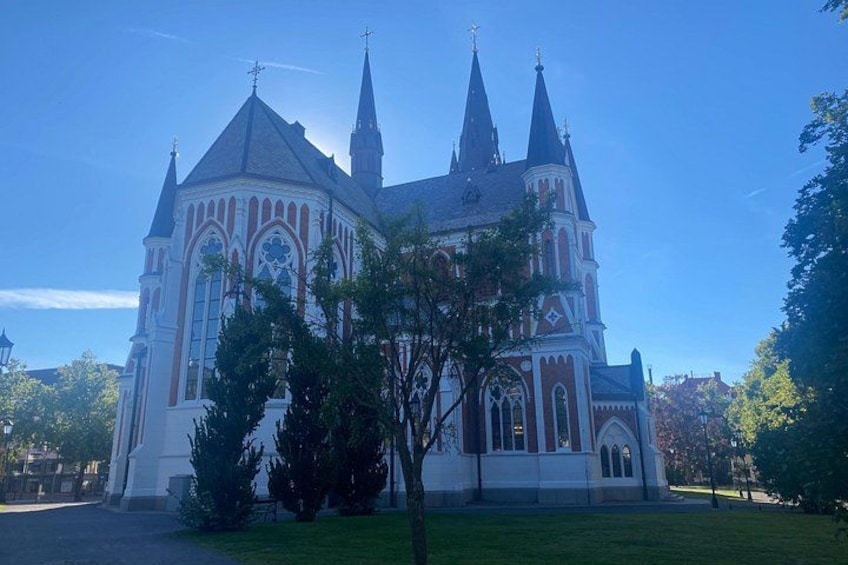 A large, historic church with multiple spires and a prominent clock tower. 4