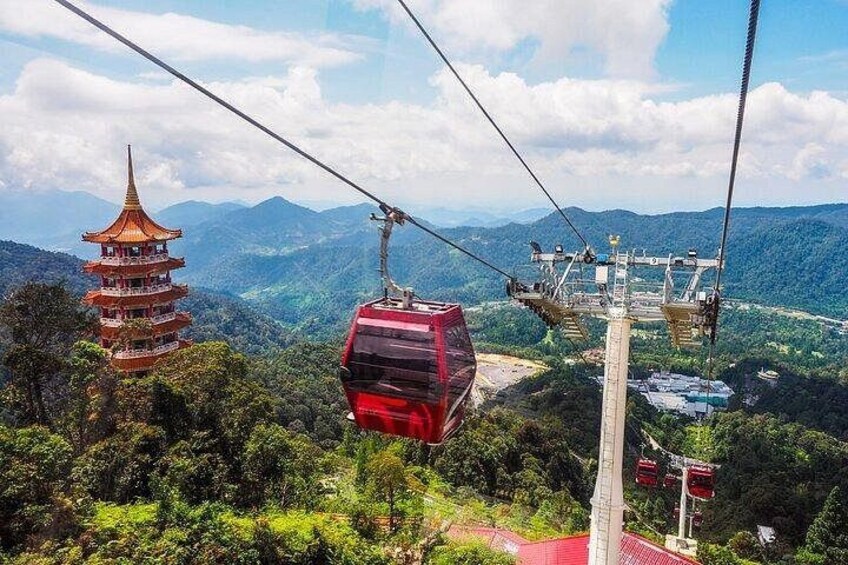 A cable car system, a pagoda, and a mountainous landscape. 1