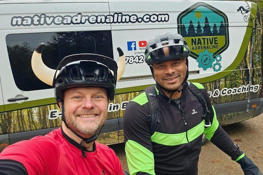 Two cyclists in front of a van with 'Native Adrenaline' branding. 3