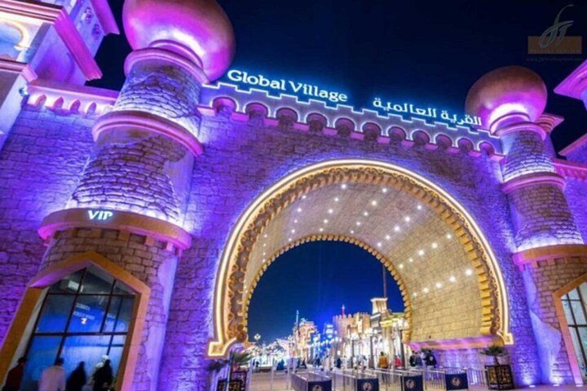 A brightly lit archway with the text 'Global Village' and 'VIP' indicating a special area. 3