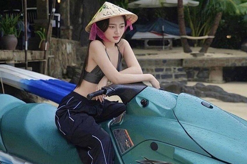 A person sitting on a jet ski. 3