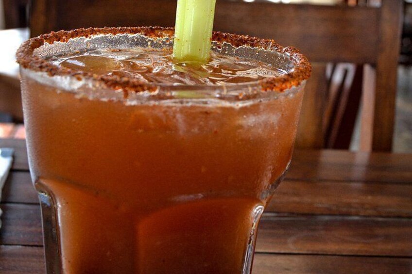 A glass of Bloody Mary with a celery stick. 4