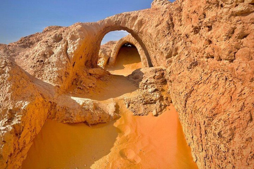 A natural rock formation with a cave-like opening. 2