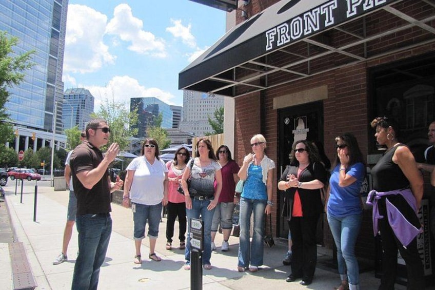 Guide presenting to group on Mass Avenue 1