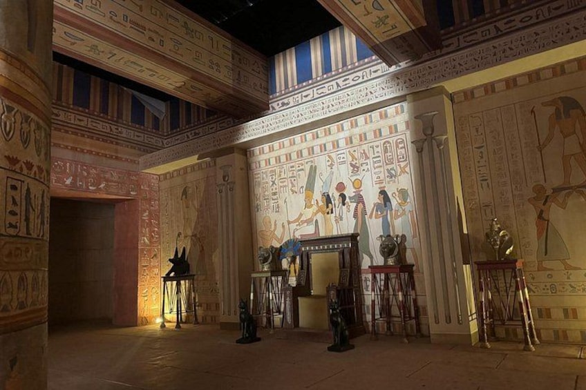 An interior with Egyptian wall art and artifacts. 3