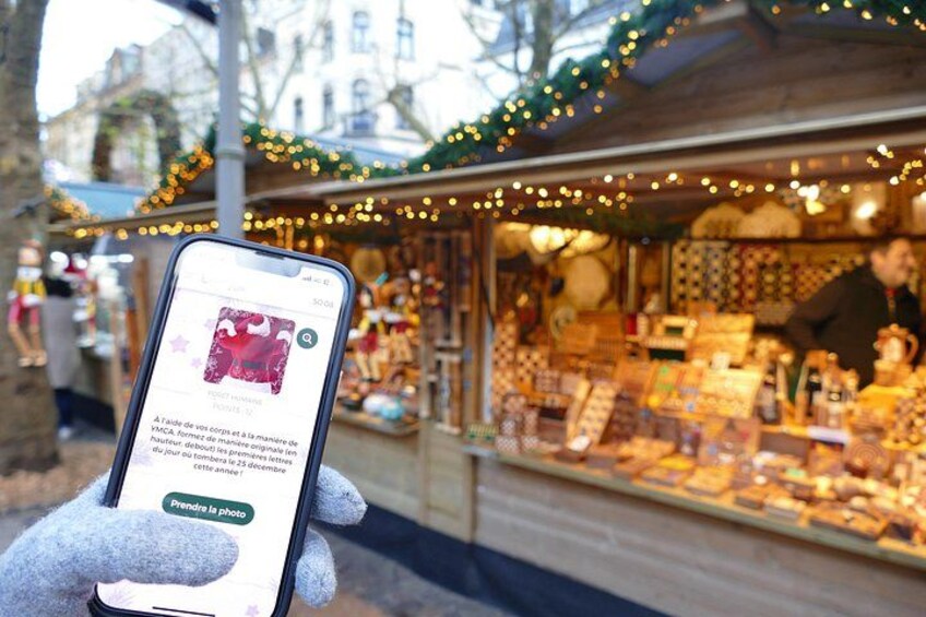 A person holding a smartphone with a photo of a market stall. 1