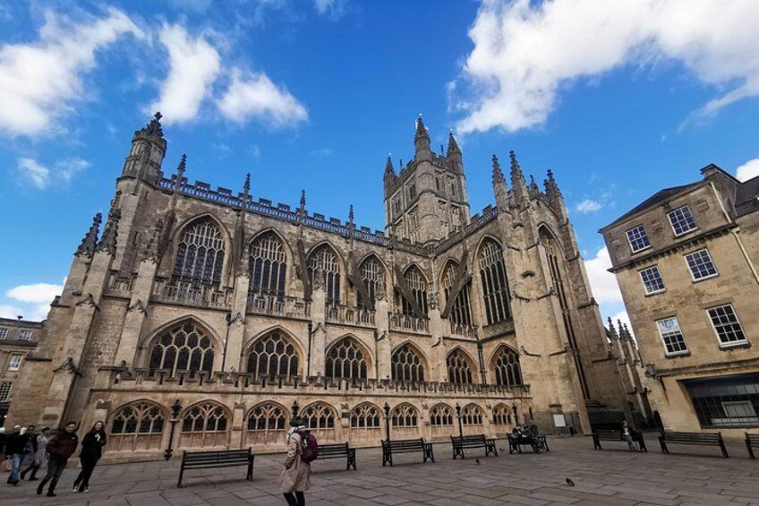 A historic cathedral with large arched windows and a tall spire. 2