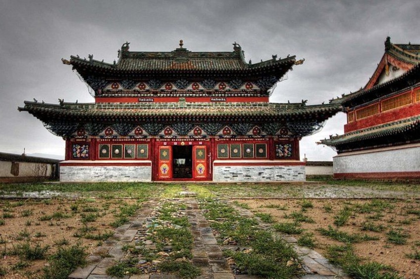 A traditional Chinese building with ornate architecture, a tiled roof, and a stone pathway leading to the entrance. 4
