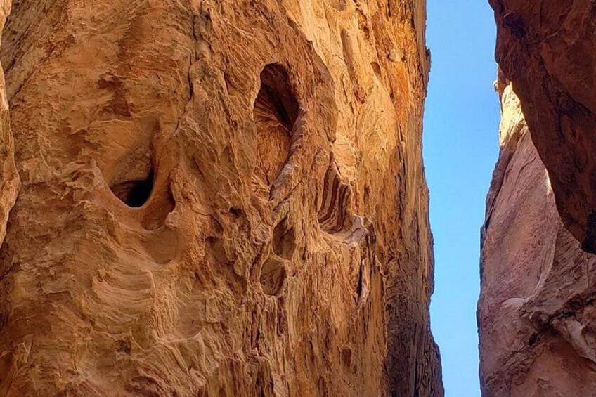 A canyon with deep, narrow passages and large rock formations. 3