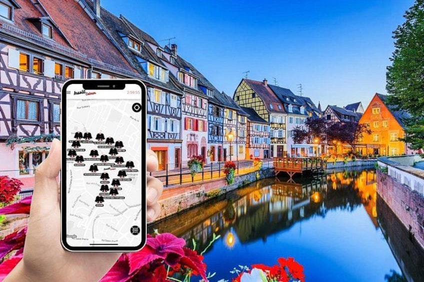 A smartphone displaying a map with a river and colorful buildings in the background. 1