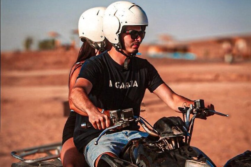 A person riding a motorcycle with a sidecar, wearing a helmet and a black t-shirt with 'A GALLERY' printed on it. 3