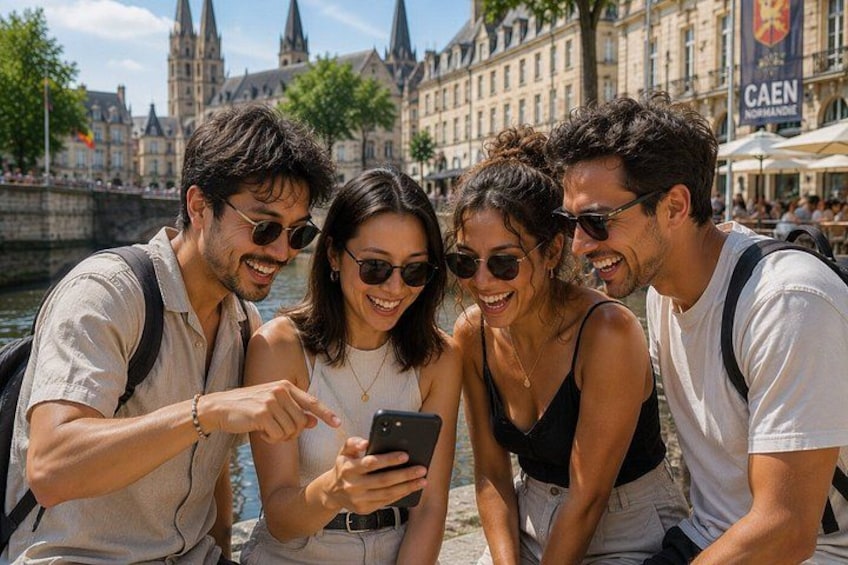 A group of people sitting by a river, looking at a smartphone. 1
