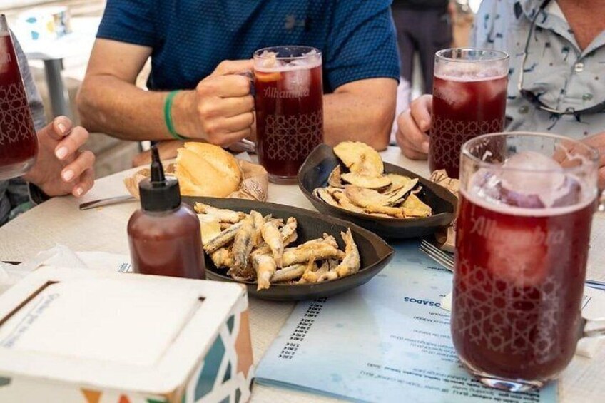 A table with food, drinks, and a menu. 5