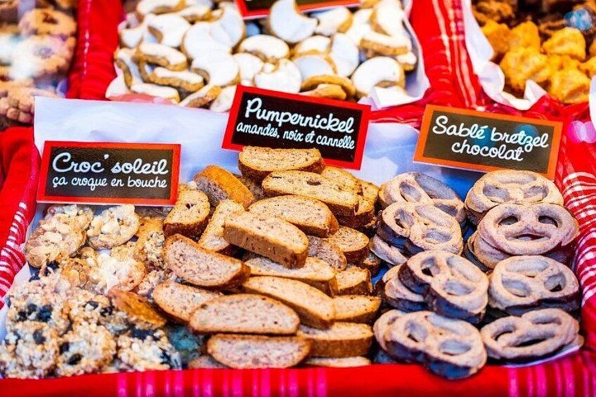 A variety of baked goods including croissants, pumpkin nut bread, and chocolate pretzels. 3