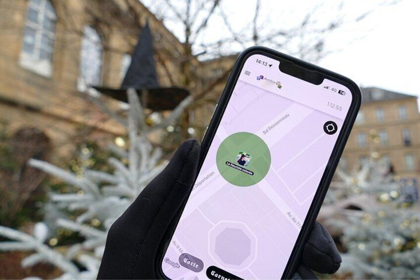 A person holding a smartphone displaying a map with a location pin. 2