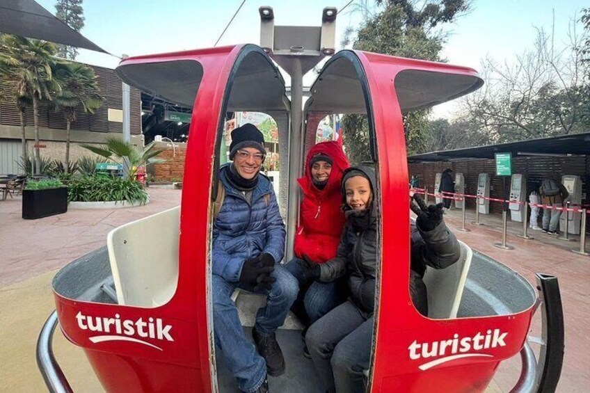 A red tourist cable car with the word "turistik" on it. 4