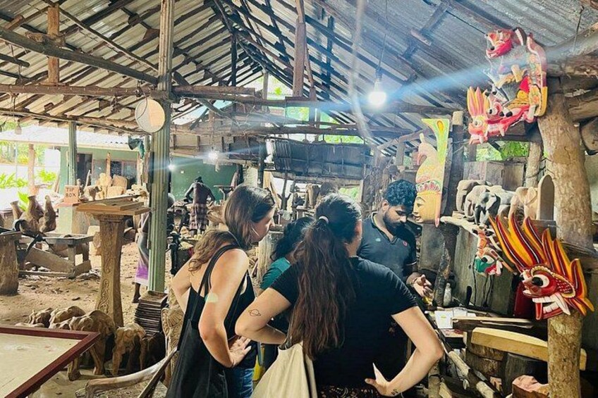 A market with wooden structures and various items for sale. 2