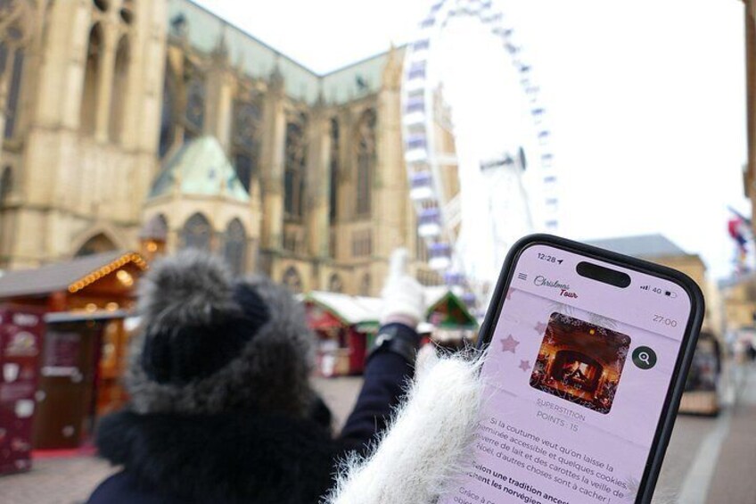 A person taking a photo of a historic building with a smartphone. 1