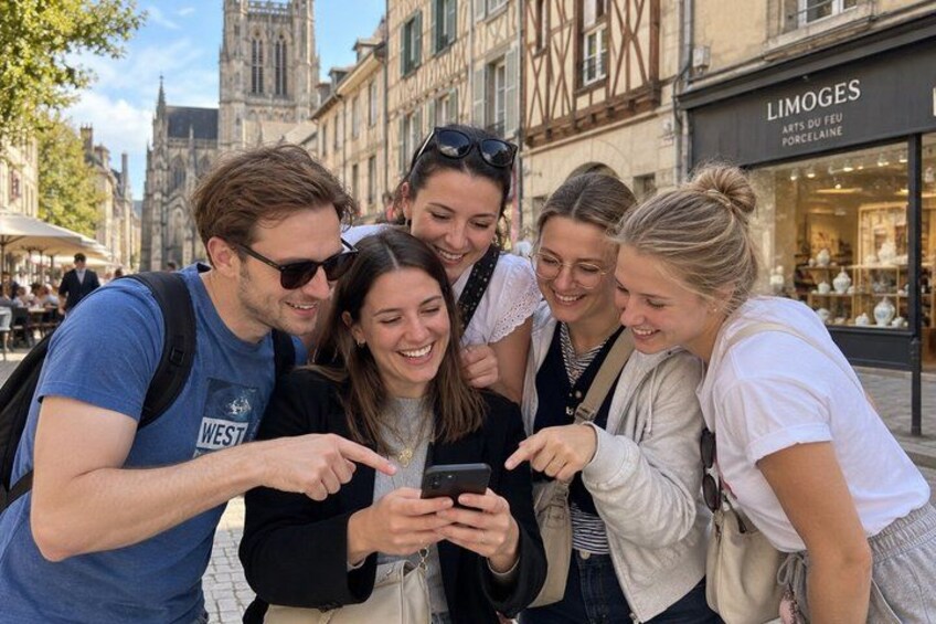 A group of people looking at a smartphone. 1