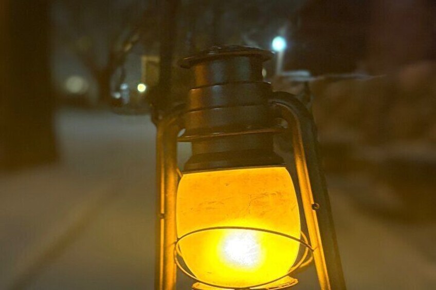 A close-up of a lantern with a glowing light inside. 3