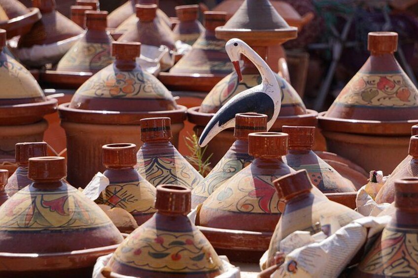 A collection of colorful, intricately designed pots. 5