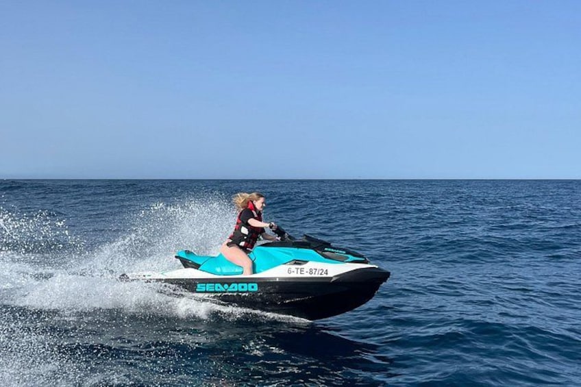 A person riding a jet ski on the water. 4