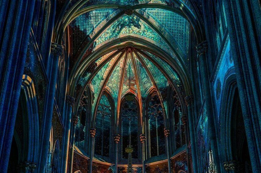 A gothic cathedral interior with pointed arches, ribbed vaults, and stained glass windows. 2
