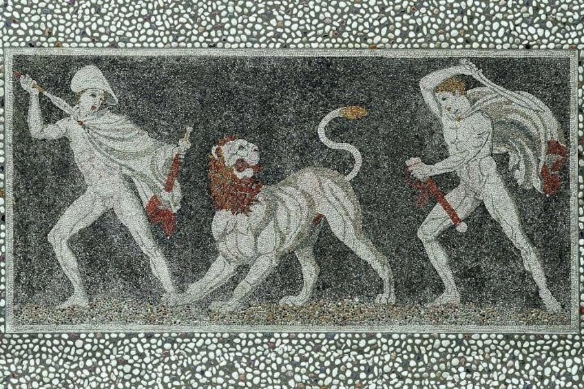 A mosaic with figures in white and red, a lion, and a horse. 1