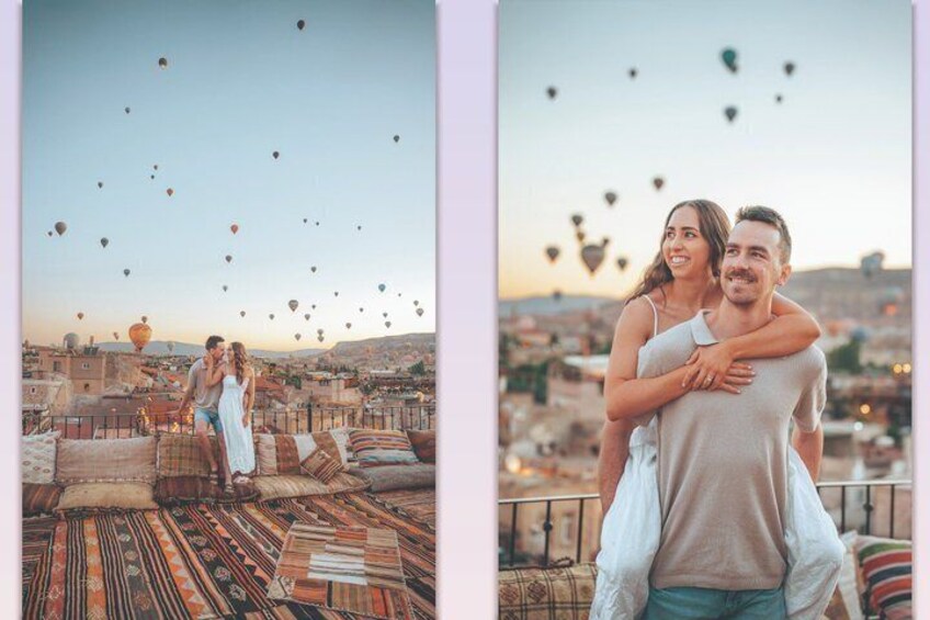 Un couple s’embrasse sur un toit, avec des montgolfières en arrière-plan. 1