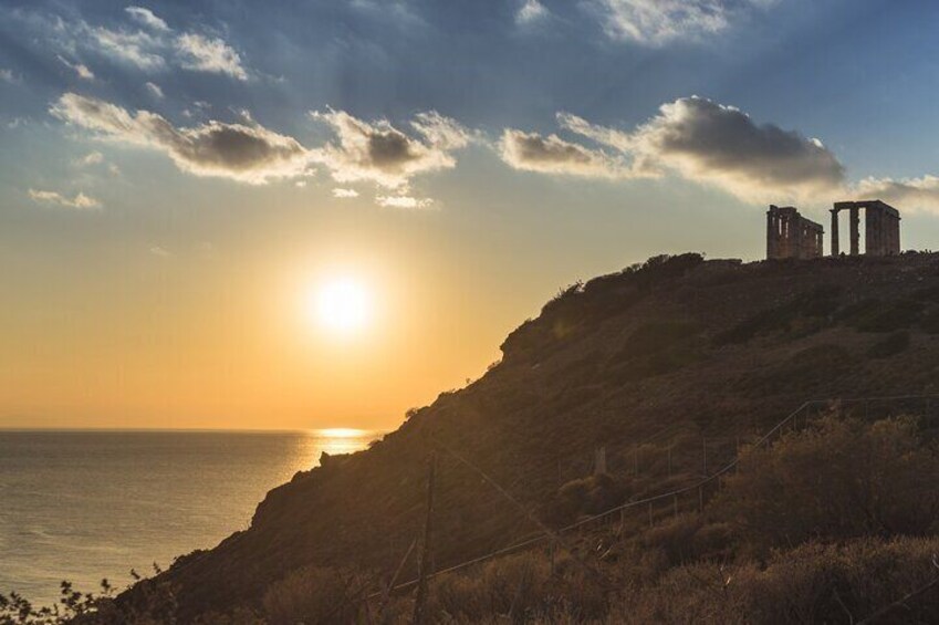 Capture the breathtaking view of the sun setting over Cape Sounion, with the Temple of Poseidon standing proudly on the horizon. A must-see moment for all visitors. 3