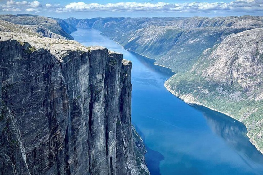 A deep gorge with steep cliffs and a river flowing through it. 3