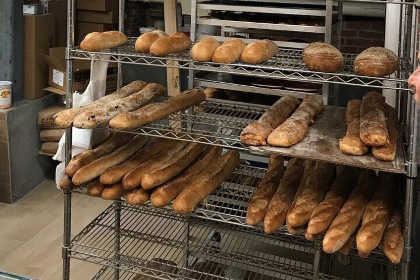 A bakery with shelves of bread. 2