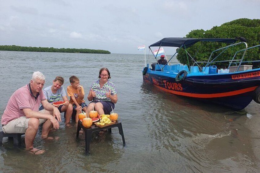 A family on a boat with a tropical backdrop. 3