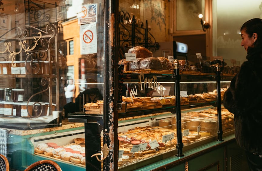A bakery display case with various baked goods. 5