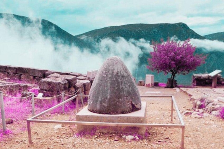 The Omphalos of Delphi, the sacred navel of the world, surrounded by mist and an ethereal landscape. 3