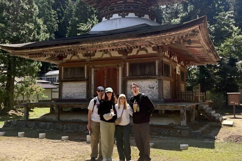 A traditional Japanese building with a wooden structure and a tiled roof. 1
