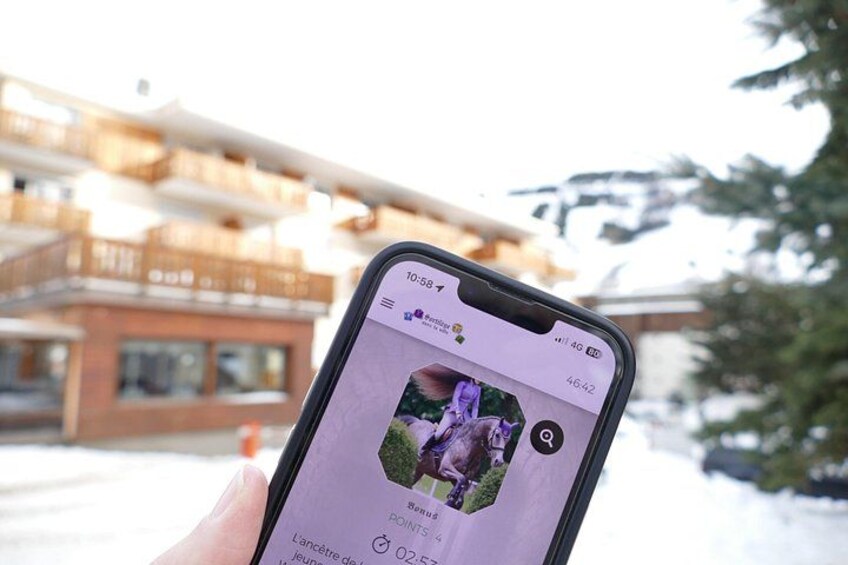 A smartphone displaying a social media post with a photo of a person in a purple outfit, a building with balconies, and a snowy landscape. 3
