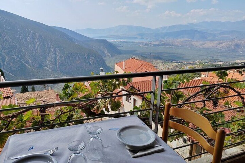 A table set outdoors with a mountain view. 3