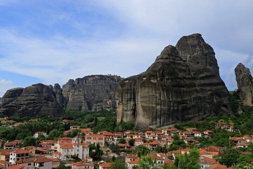 A town nestled at the base of large, rugged mountains. 4