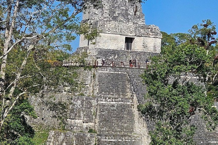 A stone structure with a staircase leading up to a platform. 3