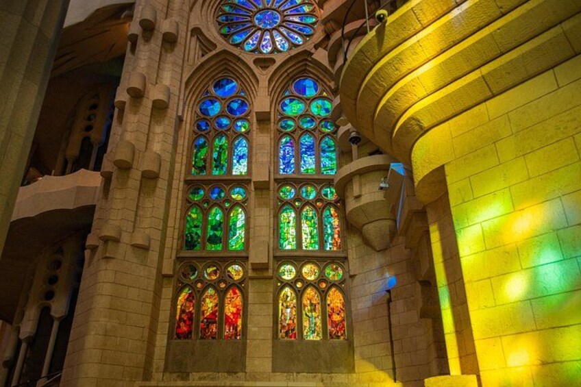 A building with large stained glass windows and a circular skylight. 4