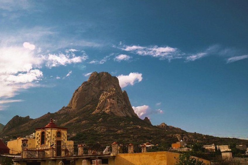 A mountain with a church at its base. 2