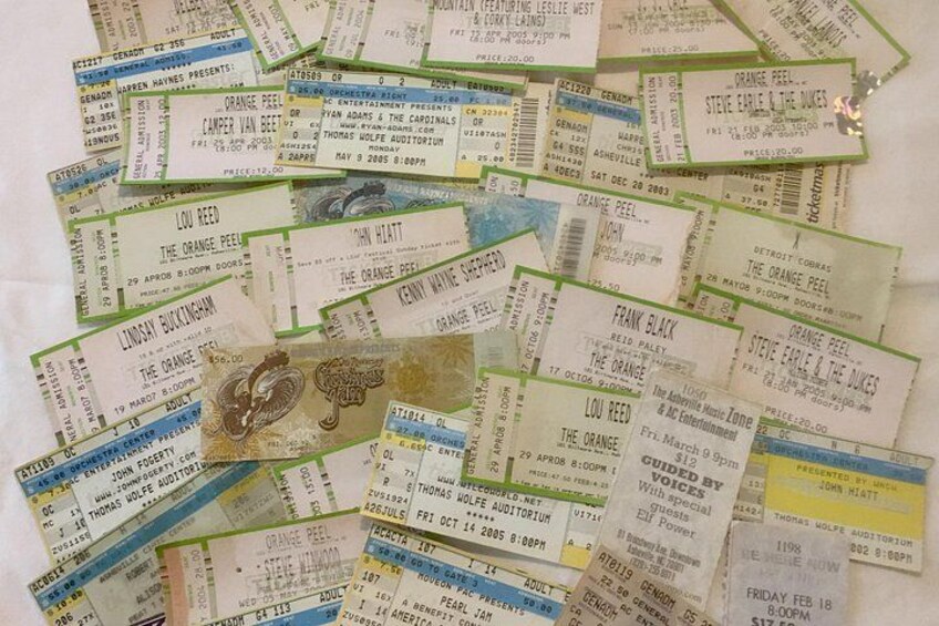 A collection of concert tickets with various artists and dates. 2