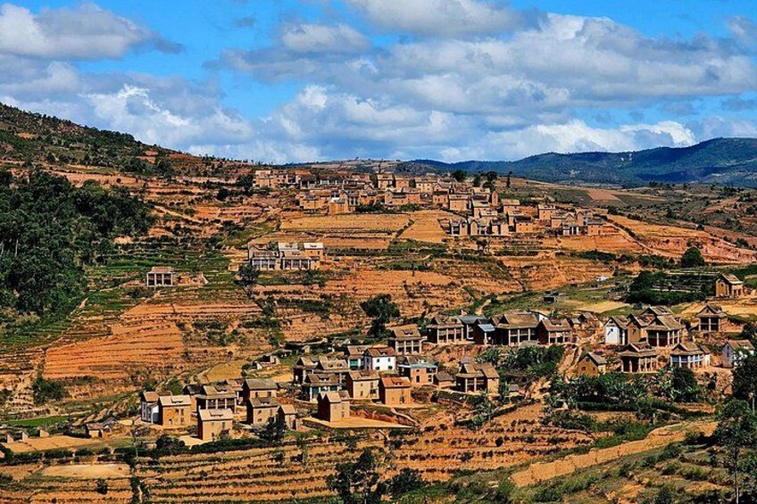 A rural village with terraced fields and traditional houses. 4