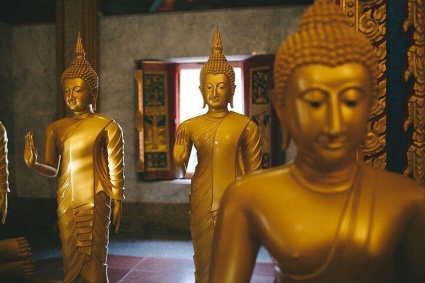 Golden Buddha statues in a temple. 4