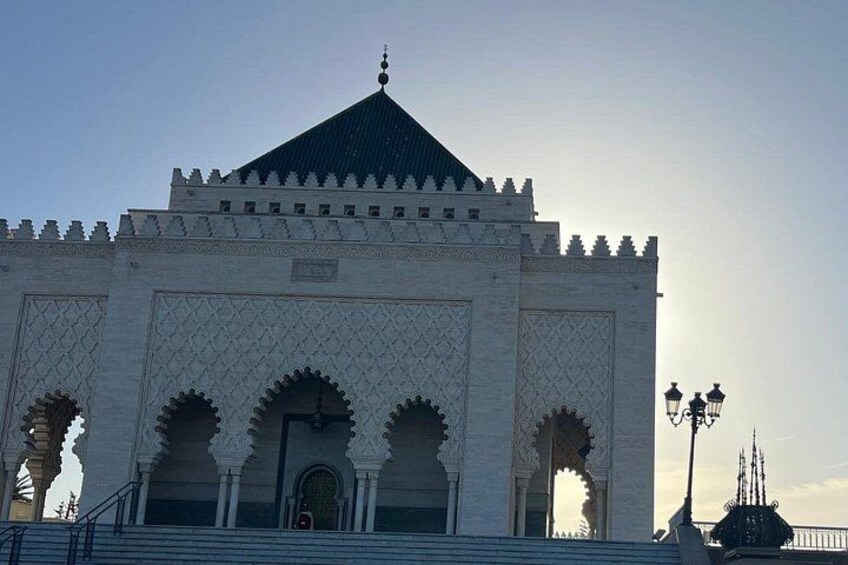 A large, ornate building with a pointed roof and multiple arches. 2