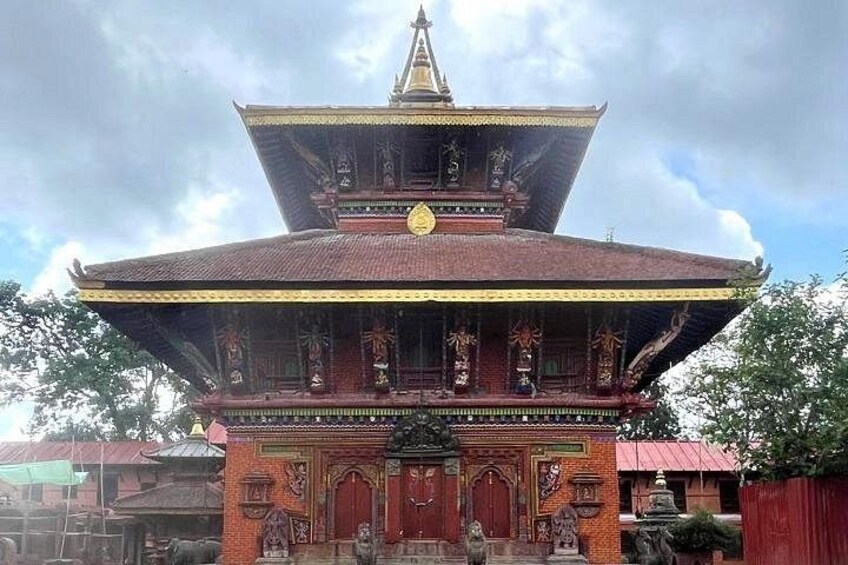 A traditional multi-tiered temple with ornate decorations and a prominent golden spire. 4