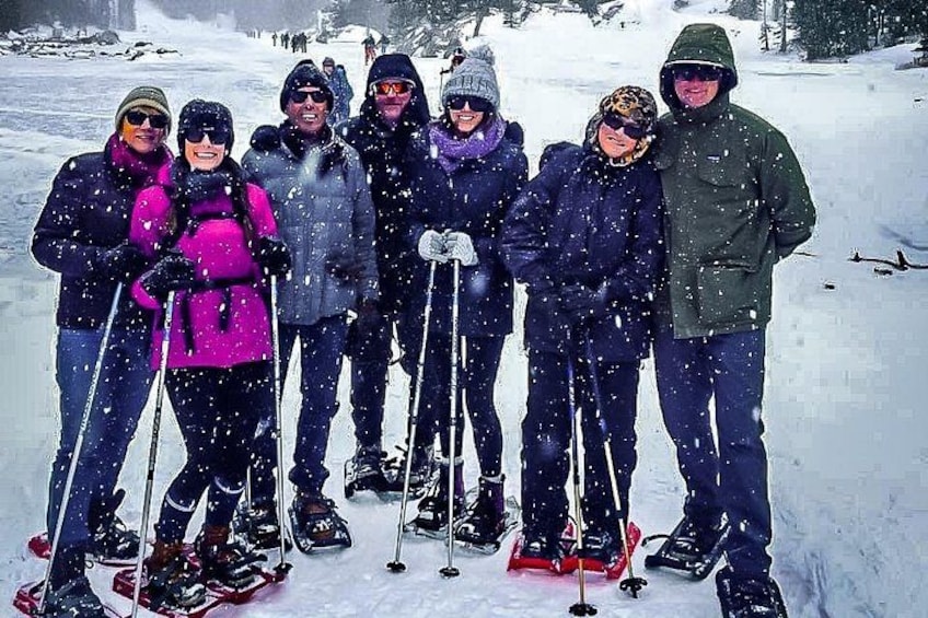 A group of people skiing on a snowy slope. 1
