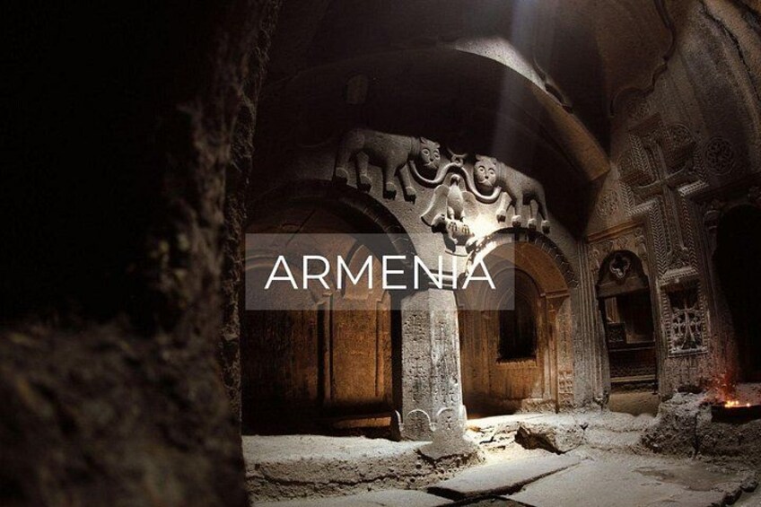 An ancient Armenian architectural site with carved stone columns and arches. 1